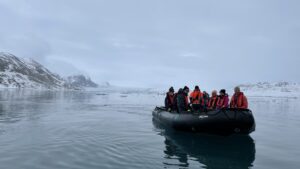 A photo of the expedition crew in a zodiac